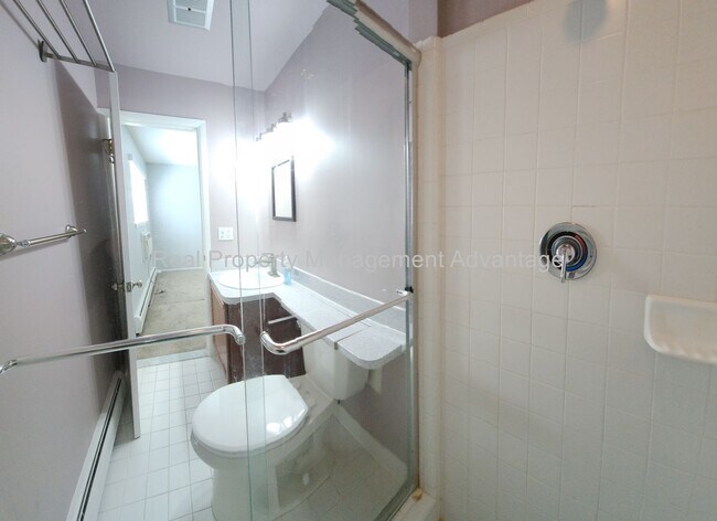 Building Photo - Spacious, Updated Condominium with Two Ful...