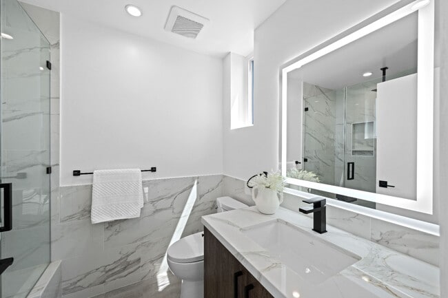 Building Photo - Stunning brand-new 3 Bedroom 4 Bathroom townhouse with private garage and rooftop balcony!