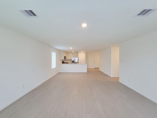 Building Photo - This lovely single-level home showcases a spacious open floorplan shared between the kitchen, din...