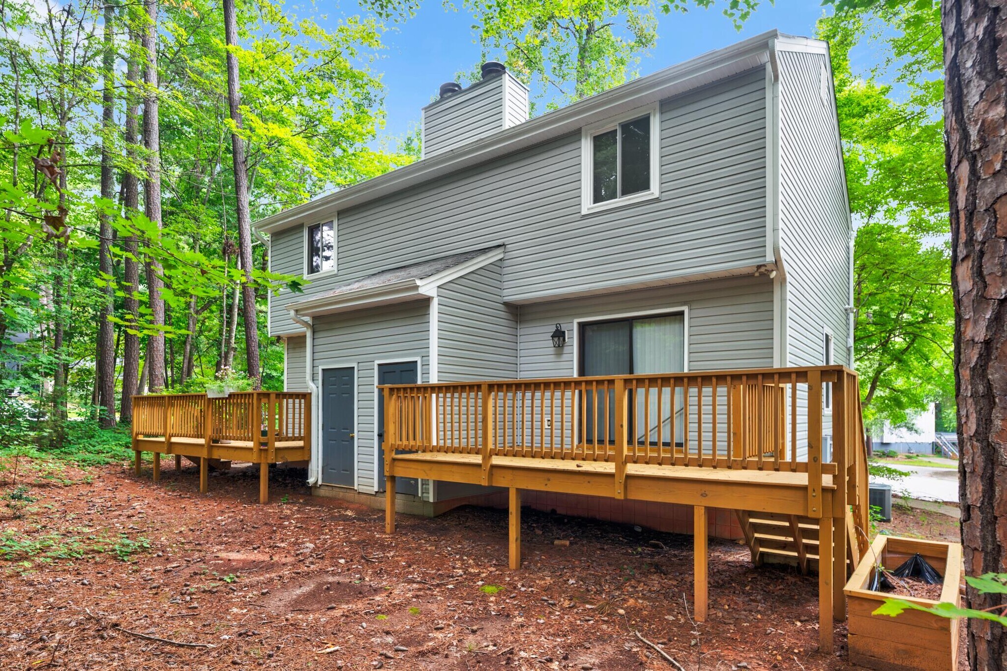 New back decks with plenty of space to entertain and a lovely wooded back yard - 4113 Arckelton Dr