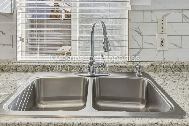 Building Photo - SE!!! 4 Bedrooms!! Master Downstairs!! No Carpet!! Synthetic Grass front and back!!