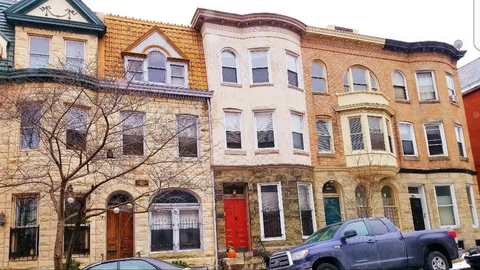 Property- building with green door - 211 E Biddle St