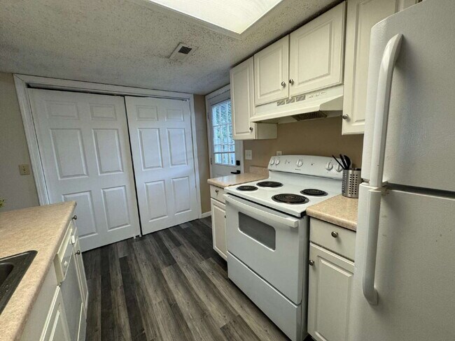 Building Photo - Love Grows — Spacious 2-Story Townhome