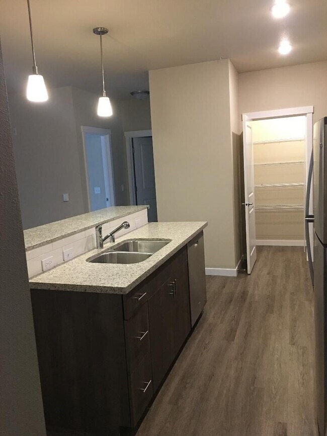 Building Photo - Stunning 1-Bedroom with Upscale Interiors & Open Island Kitchen!