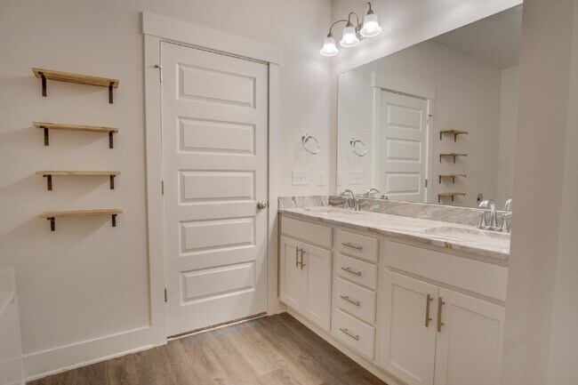 Building Photo - Spacious Cantonment Townhome with Open Layout, 2-Car Garage, Covered Back Porch & Easy Access to ...