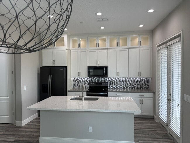 Building Photo - Lake Nona Move-In Special! Save $100/Month | 4 Bed, 3.5 Bath Laureate Park Townhome