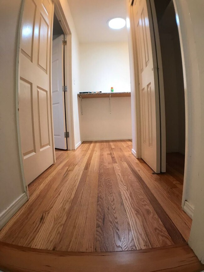 Building Photo - BEAUTIFUL WOOD FLOORS IN THIS 5 BED 2 BATHROOM HOUSE- LARGE DOGS OK