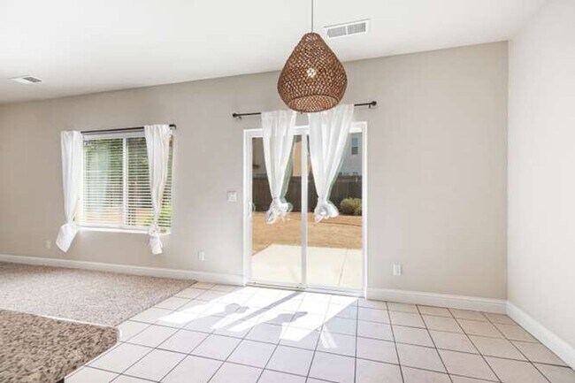 Building Photo - Four bedroom/2-bath home with 2-car garage