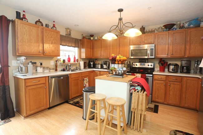 Building Photo - Available -Spacious 2 Car Garaged Townhome...