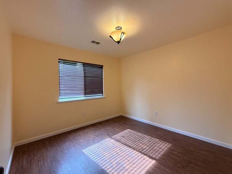 Downstairs bedroom from doorway - 3326 Amberfield Cir
