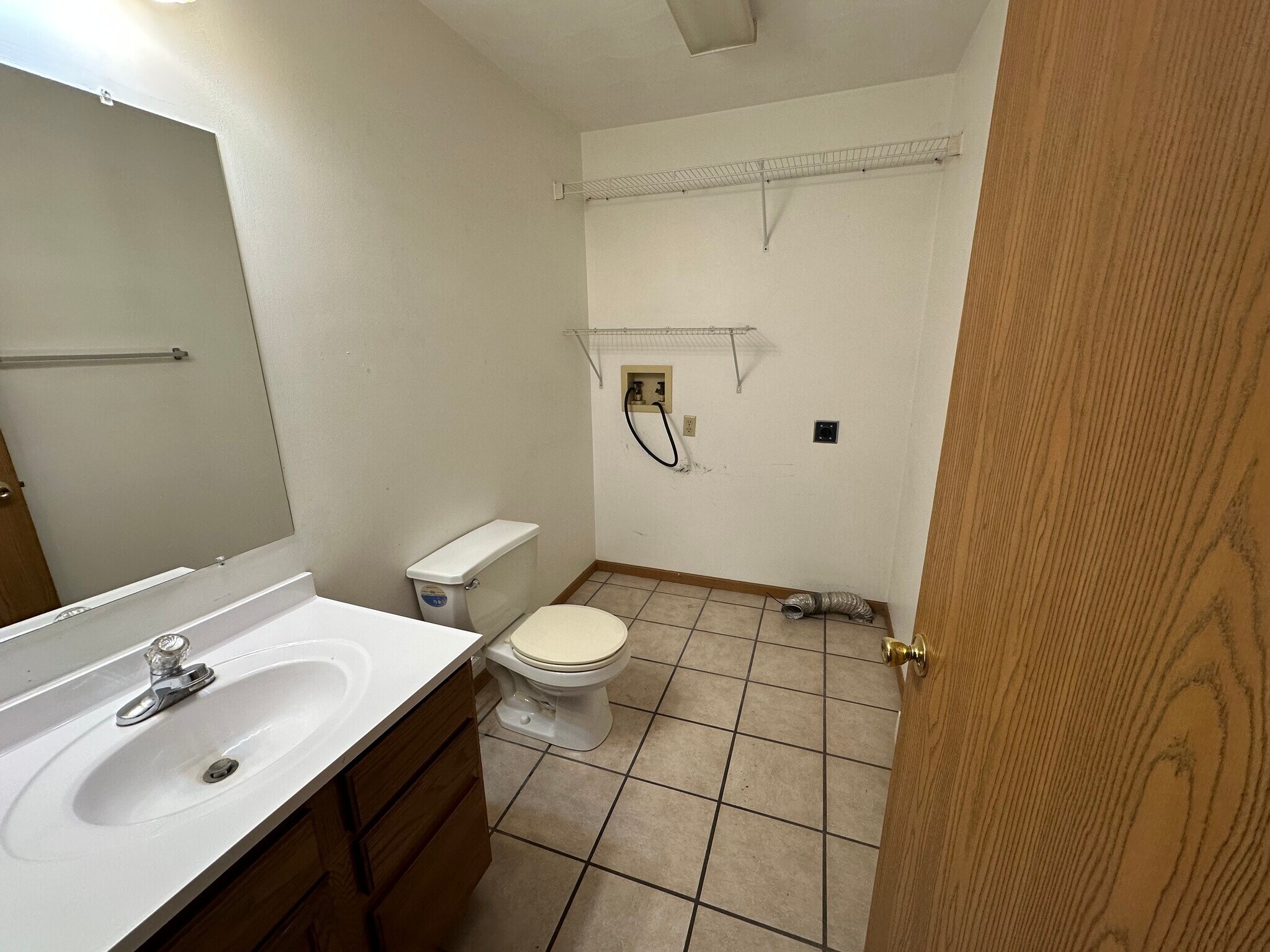 Washer & electric dryer hookup and half bath downstairs - 1010 Lakeshore Dr