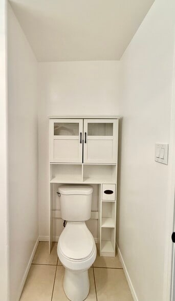 Toilet With Storage Or organizer - 9845 Rosecrans Ave