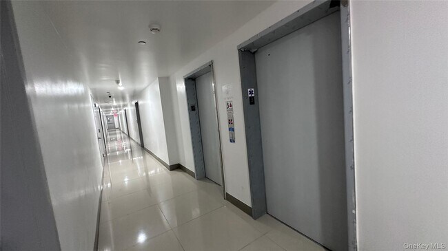 Building Photo - 70-25 Queens Blvd