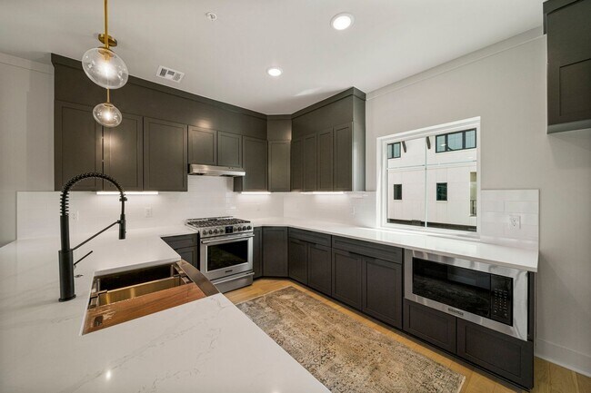 Building Photo - Discover modern elegance in the newly constructed Edgewater Condominiums, a boutique community fe...