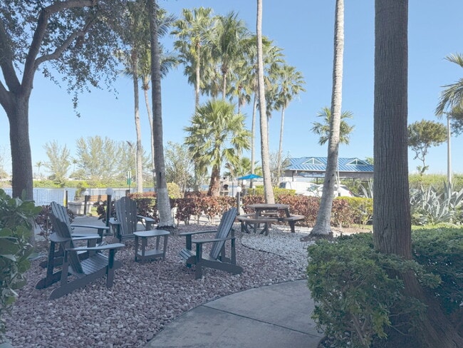 Building Photo - Rare 2/2 Corner Penthouse with Panoramic Lagoon Views from Every Room – Available Now!