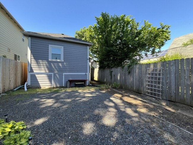 Building Photo - Charming Cottage with Hardwood Flooring, Modern Kitchen & Beautiful Outdoor Living Areas