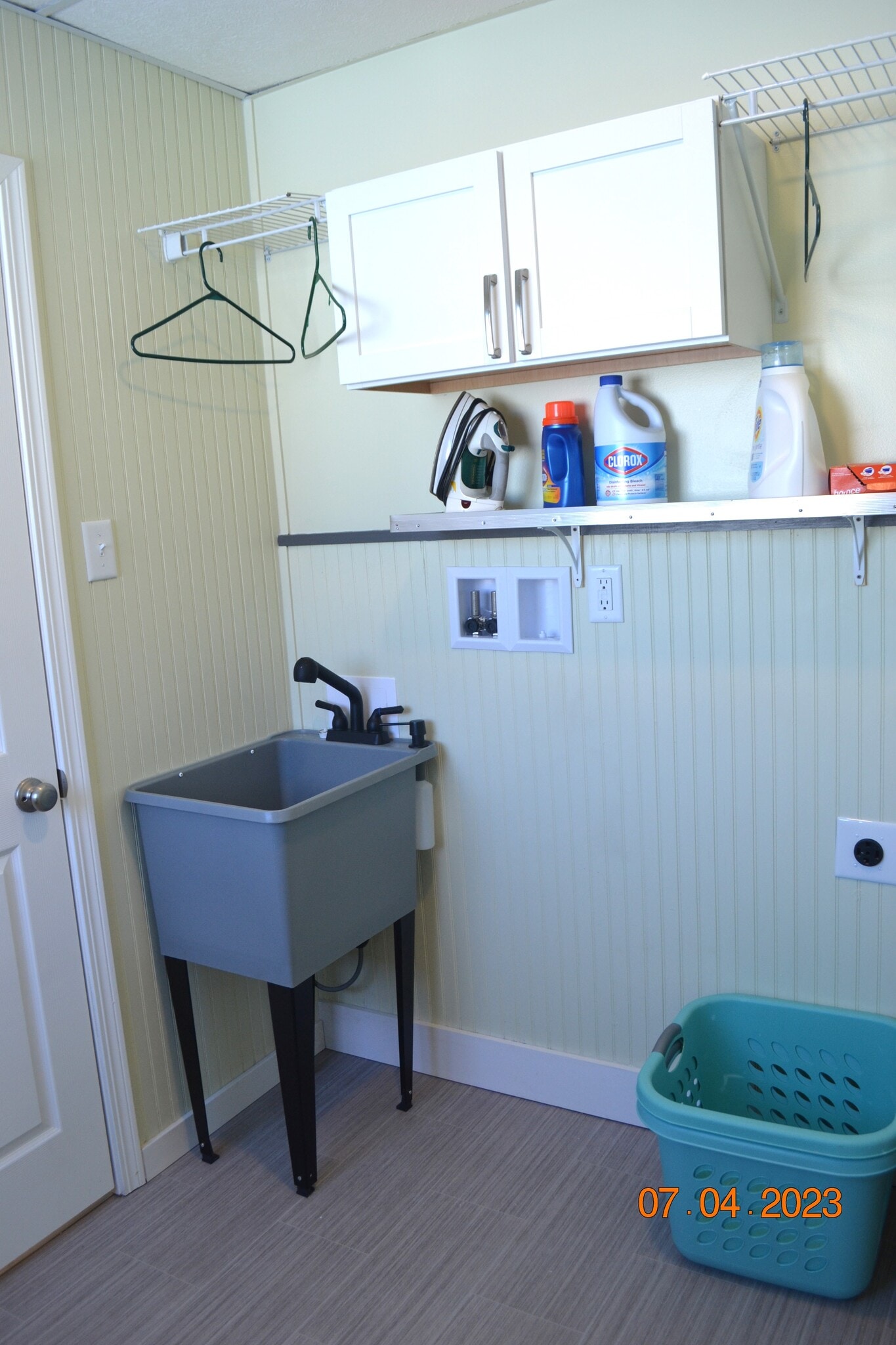 laundry room has tub and hookups - 222 W Peck St
