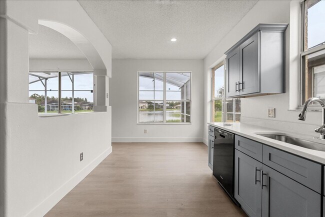 Building Photo - Stunning 4-Bedroom Lakefront Pool Home in Bridgeview at Meadow Woods