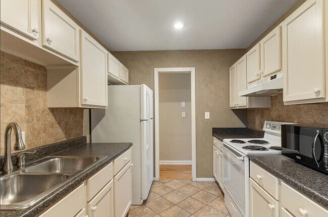 Building Photo - Located in the heart of Brookside, this inviting home sits on a spacious, fully fenced corner lot.