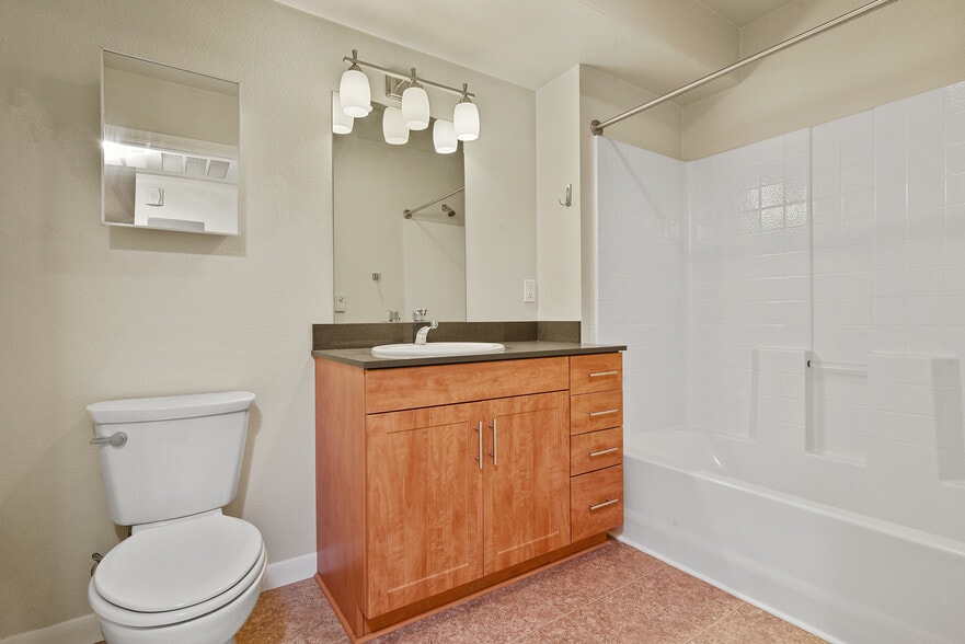 Lovely, roomy bathroom with tile floors - Avenue Heights Apartments Building 1