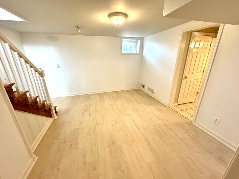 Living Room or Bedroom, with New Light-Wood Design Tile - 201 E Indian Spring Dr