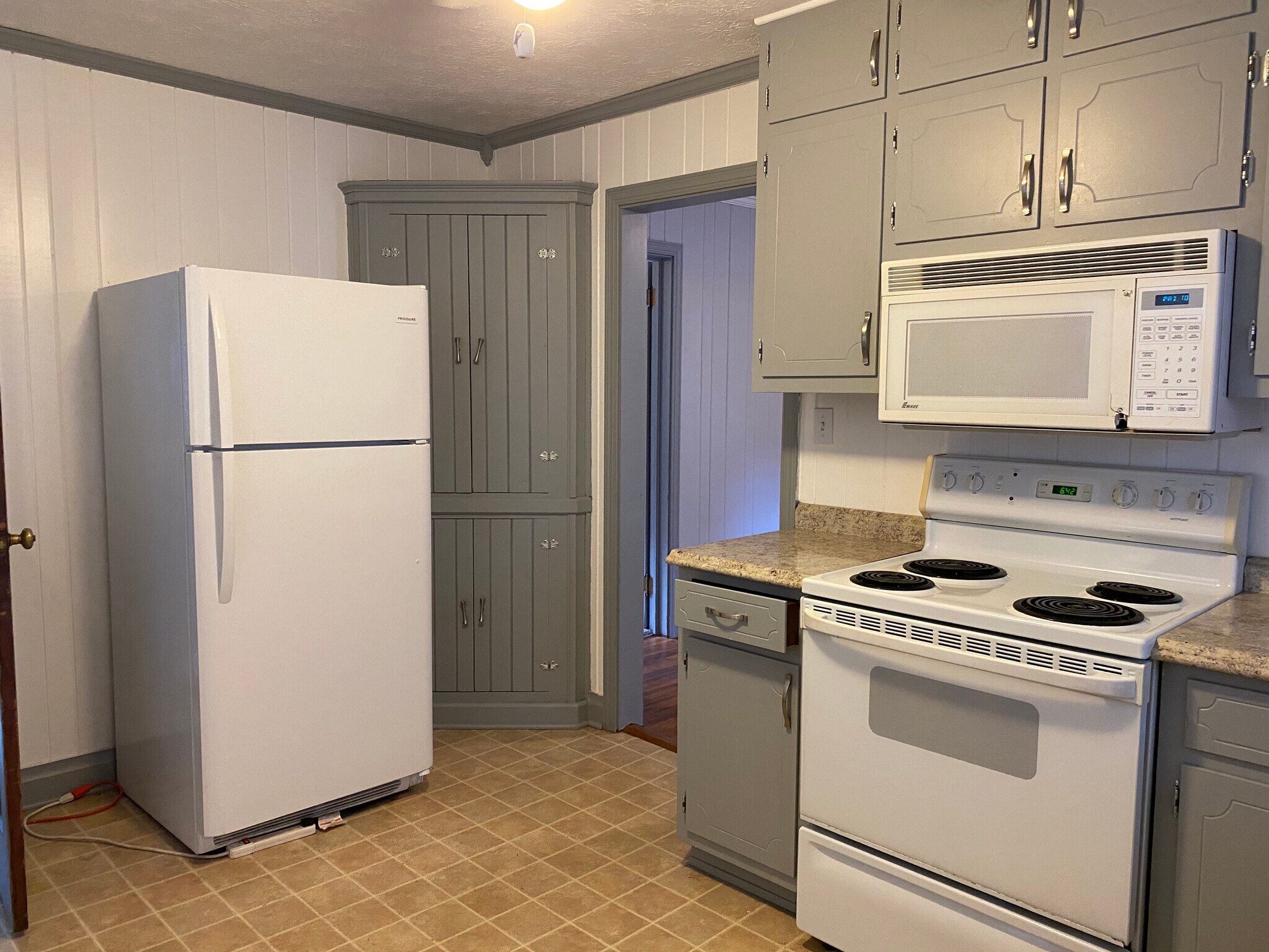 Updated kitchen with newer fridge and microwave - 206 Griffith St