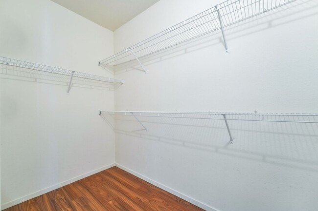 Building Photo - Modern Ground-Level Condo With A One Car Garage in Prime Southwest Location with Resort-Style Ame...