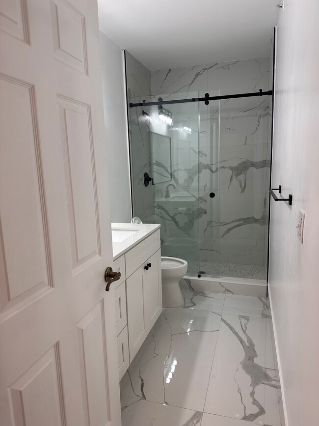 New tile floors and showers - 634 Fern St