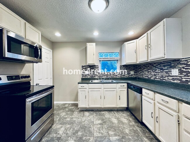 Building Photo - Adorable Home Featuring Wood Floors, SS Ap...