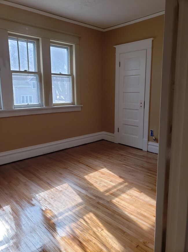 Bedroom #1: Floors completely refinished and fresh paint. - 522 N 42nd Ave W