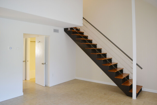 Front living room, stairs to loft. - 452 S Main St