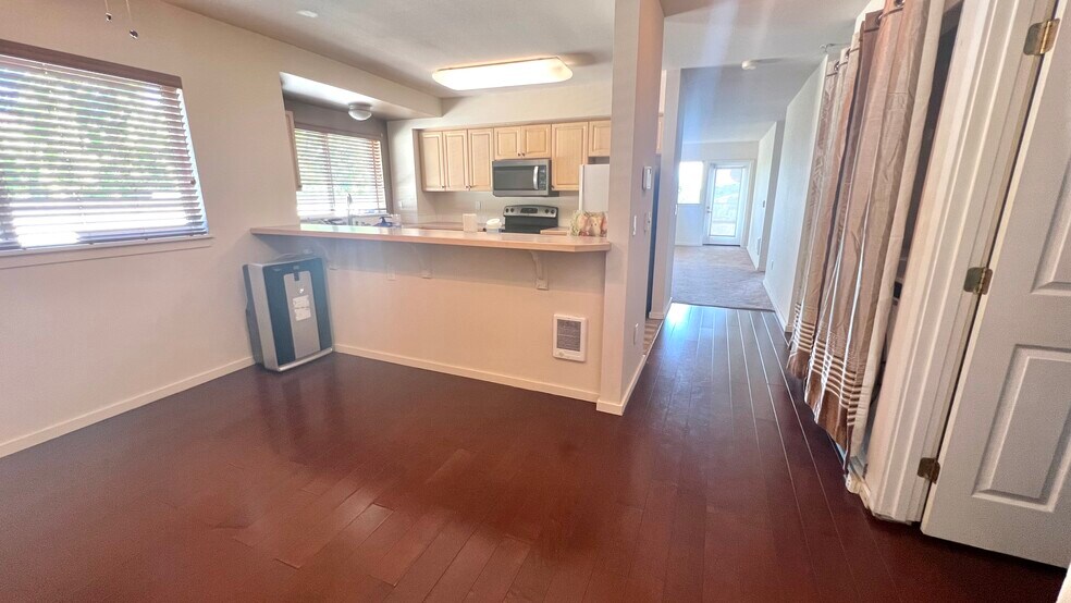 Dining and Kitchen (view from front door) - 15340 Macadam Rd S