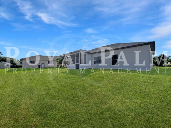 Building Photo - 3BR/2BA Home Ready to Bloom in Lehigh Acres + GARAGE!!