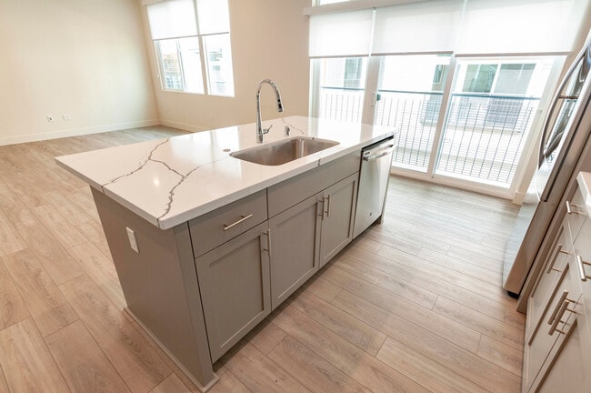 Building Photo - Experience contemporary urban living at its finest. Private Garage & Dual Suites!