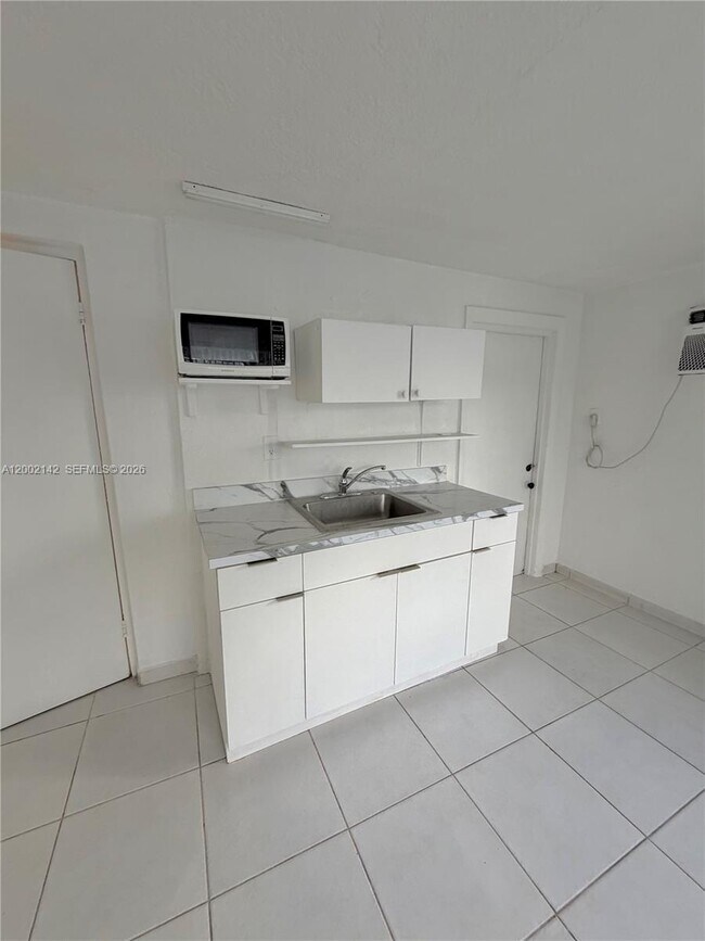 Building Photo - 3390 W 12th Ave