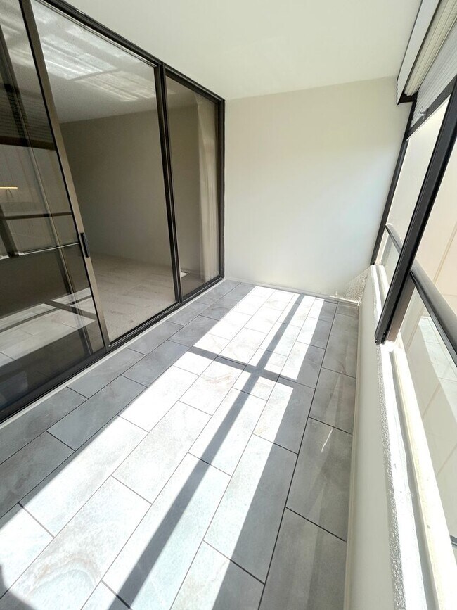 Building Photo - Available Now - High Floor Studio Apartmen...