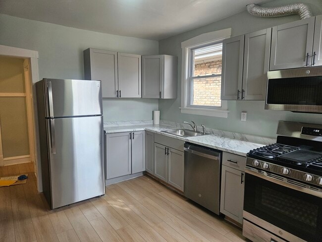 Building Photo - 6125 W Newport Ave