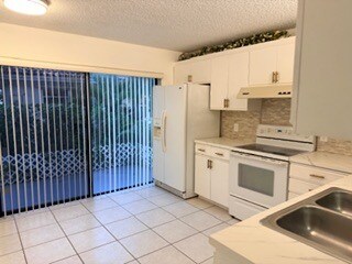 Kitchen with Patio - 7473 Champagne Pl