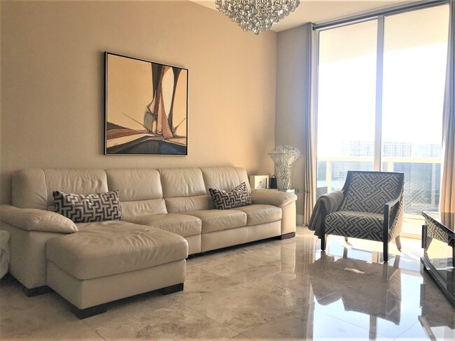 Living Room with crystal chandeliers - 15901 Collins Ave