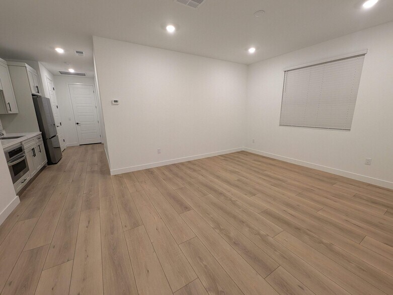 New kitchenette and large 18' x 13' living room with modern plank flooring - 628 S Cecita Wy