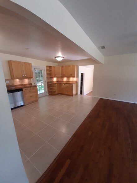 Two doors lead to the backyard: one from the kitchen and one from the walk-in storage closet.. - 2955 Fantasy Ln