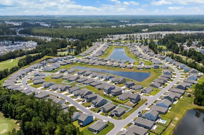 Building Photo - Modern 4BR Home with Screened Porch & Pond Views | Sun Colony, Longs SC
