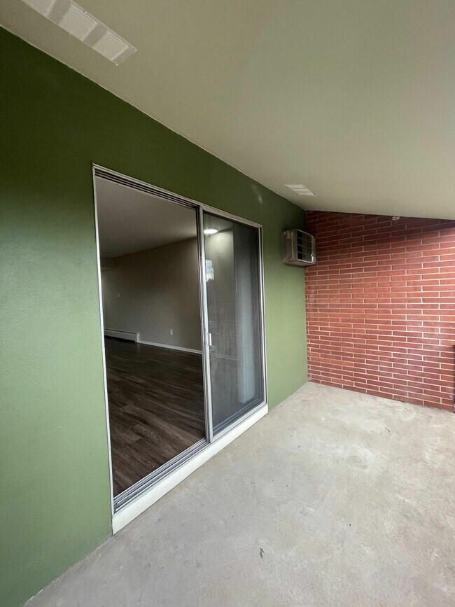 Step into comfort with this welcoming patio space, perfect for relaxing - GRACE LANDINGS APARTMENTS