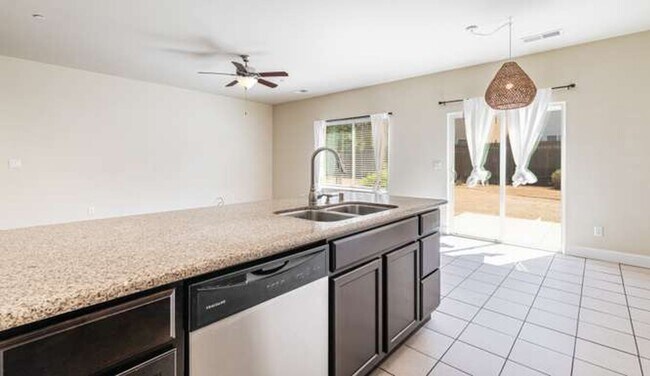 Building Photo - Four bedroom/2-bath home with 2-car garage