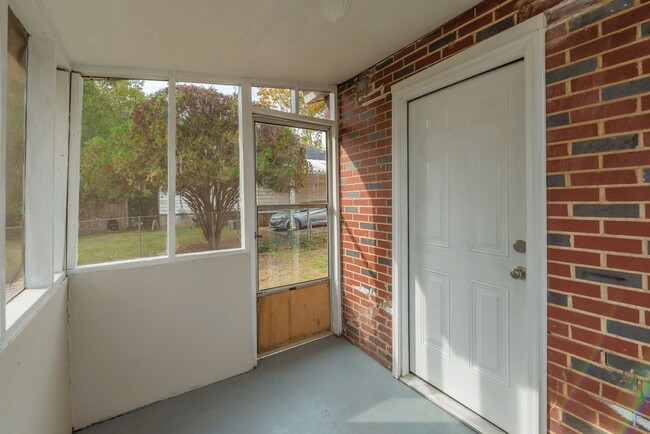 Building Photo - Brick home with a fenced-in yard!
