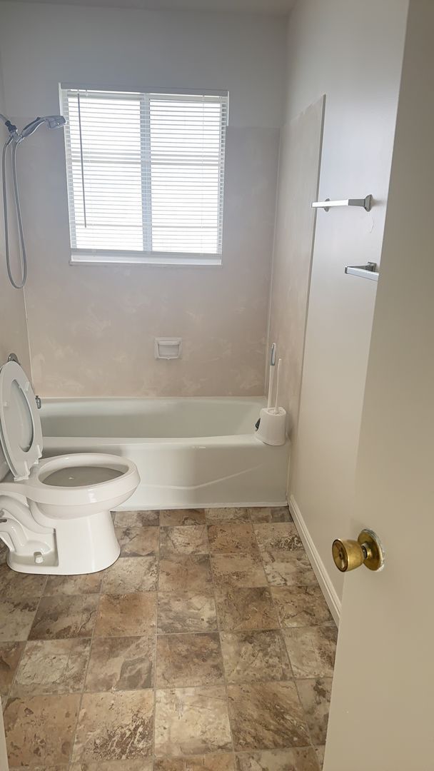 Building Photo - Beautiful townhome with air conditioner and carport