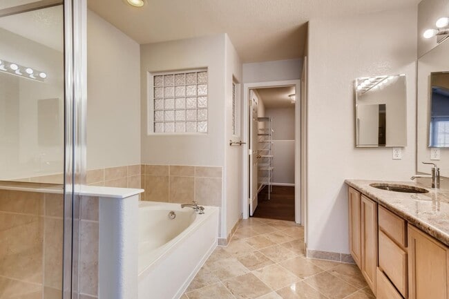 Building Photo - Stunning 3-bed 3-bath townhome that features hardwood floors and an attached 2-car garage!