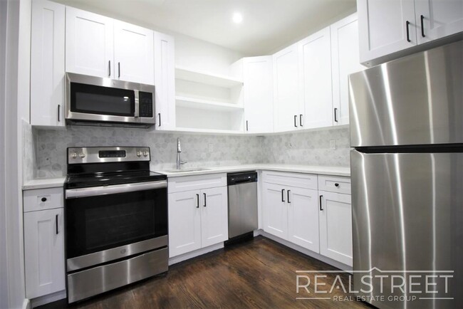 Building Photo - Stunning Giant New 2 BED with GARAGE & W/D...