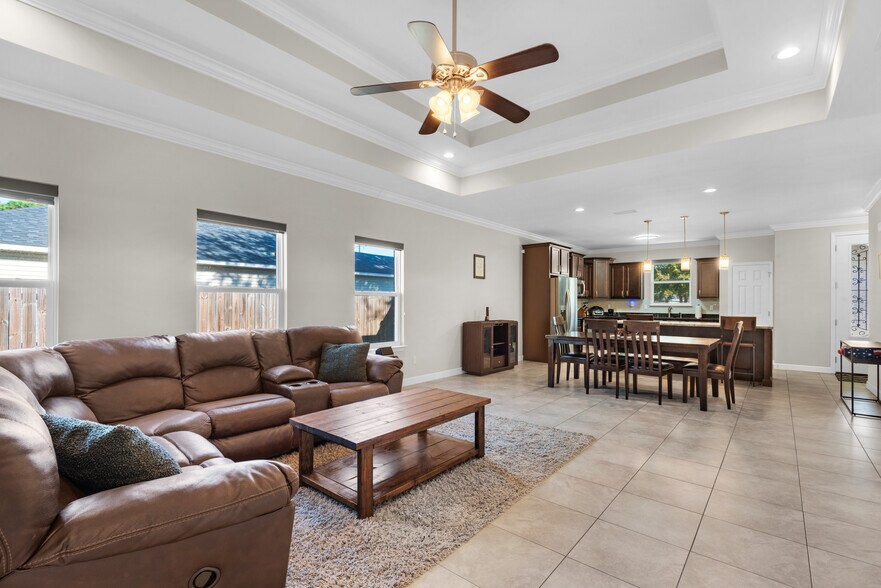 Living room has a huge TV, surround sound, blackout shades, and huge couch - 28 Snook Rd