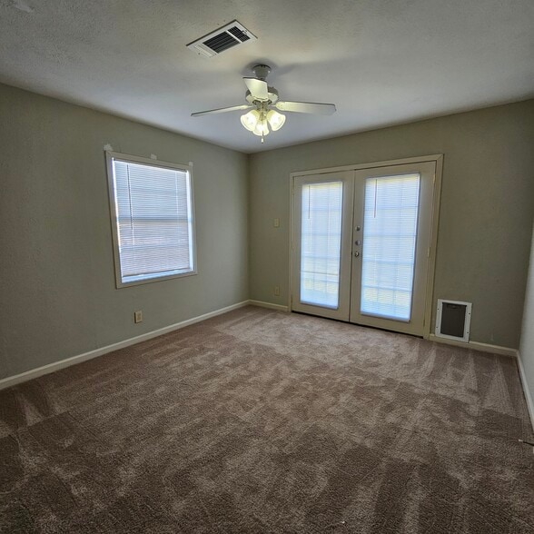 Bedroom 2 w/Backyard Access - 10128 Kilarney Dr